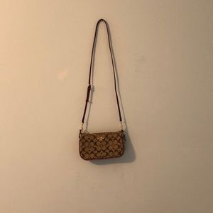Brown and pink coach hand bag. Authentic and real.